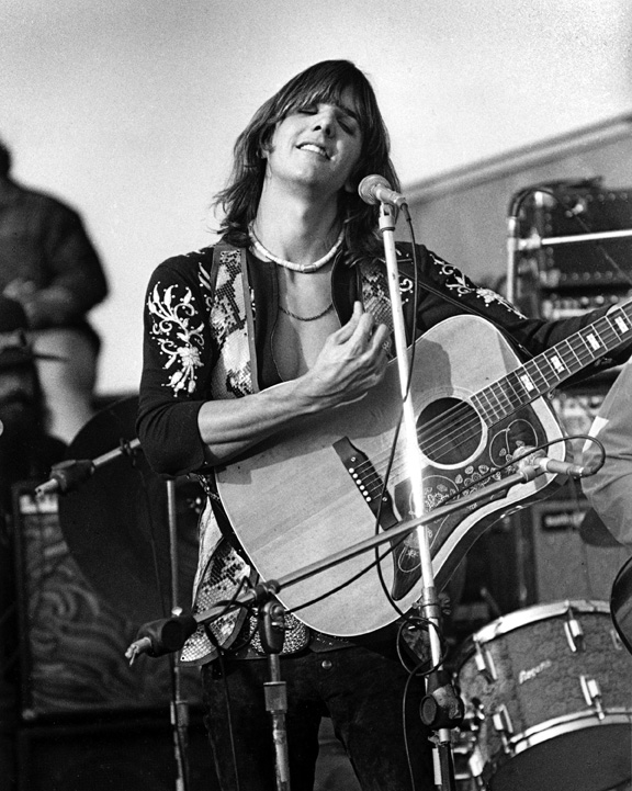photo:  Gram Parsons, originator of Country Rock music and member of The  Flying Buritto Brothers playing at The Altamont Speedway on December 6, 1969