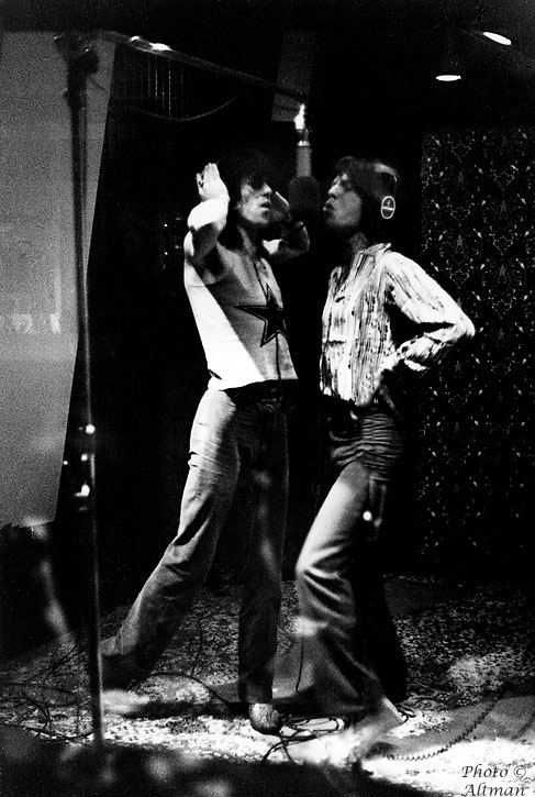 [Photo of Mick Jagger and Keith Richards recording]